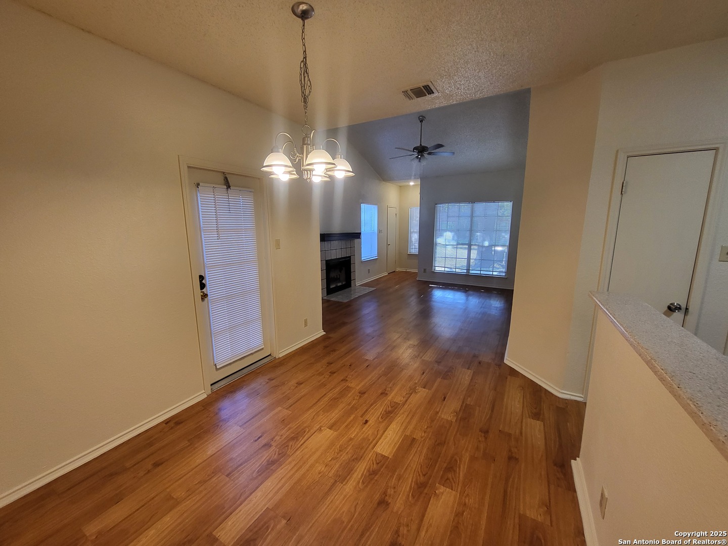 3405 Ridge Smoke San Antonio, TX 78247 - Photo 7 of 16 a view of a big room with wooden floor and a kitchen