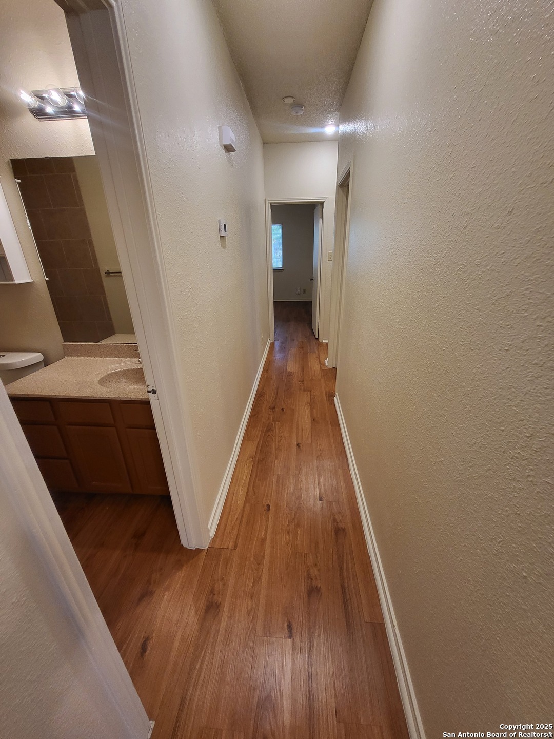 3405 Ridge Smoke San Antonio, TX 78247 - Photo 8 of 16 a view of entryway with wooden floor