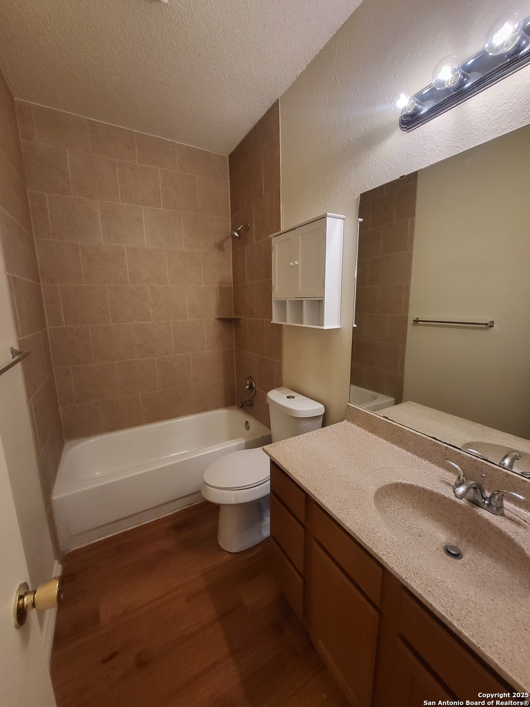 3405 Ridge Smoke San Antonio, TX 78247 - Photo 9 of 16 a bathroom with a sink a toilet and bathtub