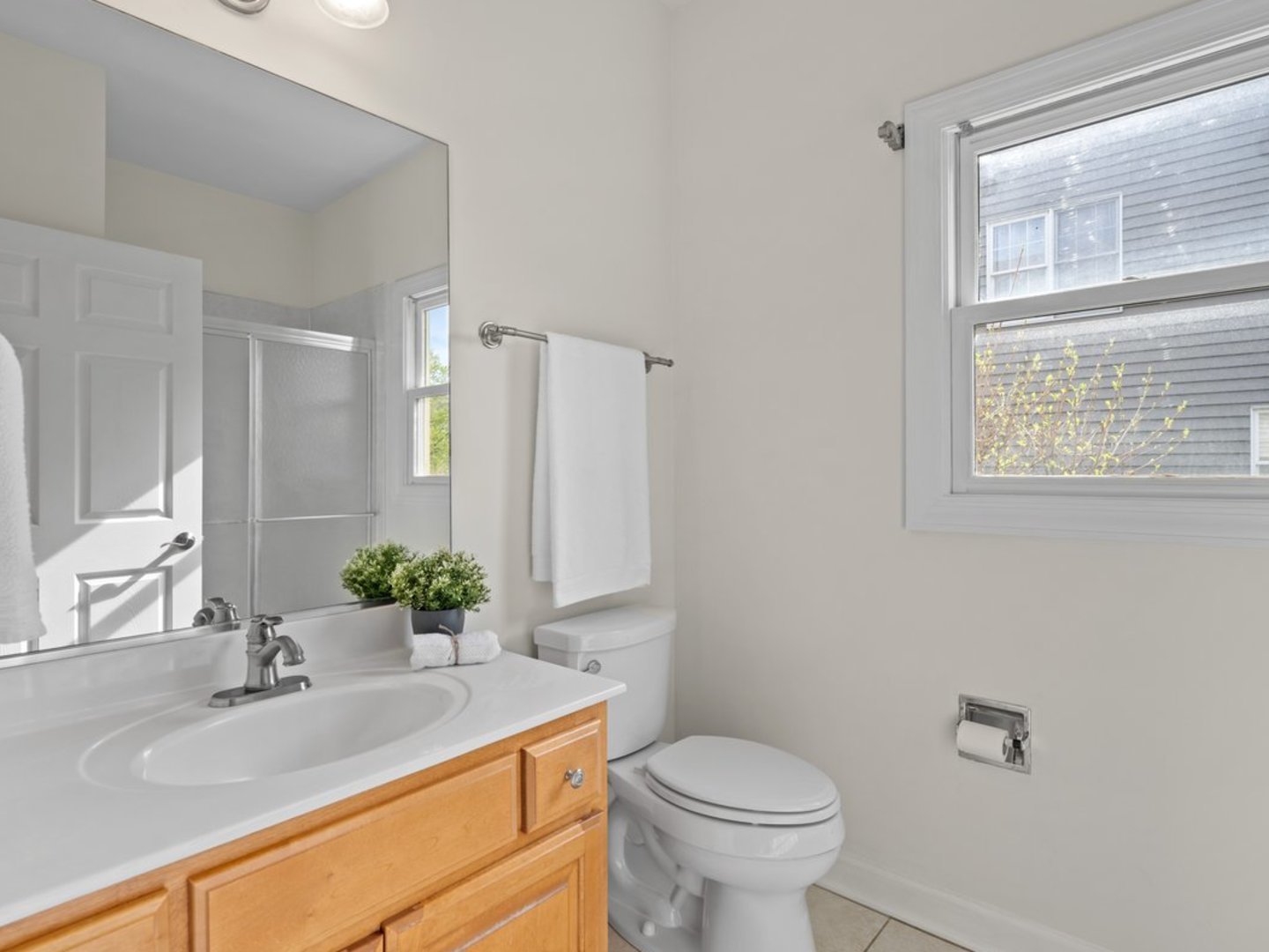 3035 Rollingridge Road Naperville, IL 60564 - Photo 13 of 28 a bathroom with a granite countertop sink toilet and mirror