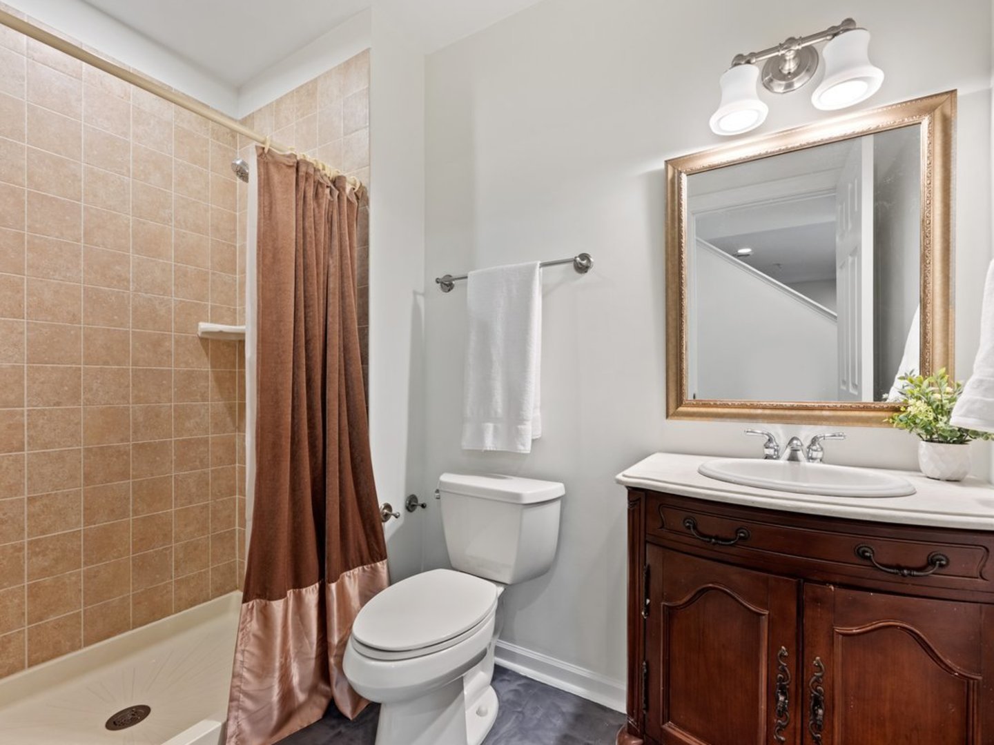 3035 Rollingridge Road Naperville, IL 60564 - Photo 23 of 28 a bathroom with a sink a toilet and shower
