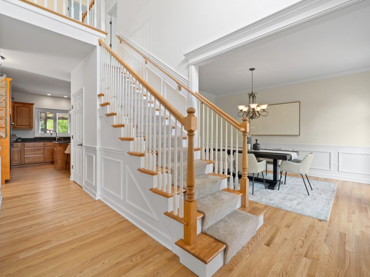 3035 Rollingridge Road Naperville, IL 60564 - Photo 9 of 28 a view of a hallway with wooden floor and staircase