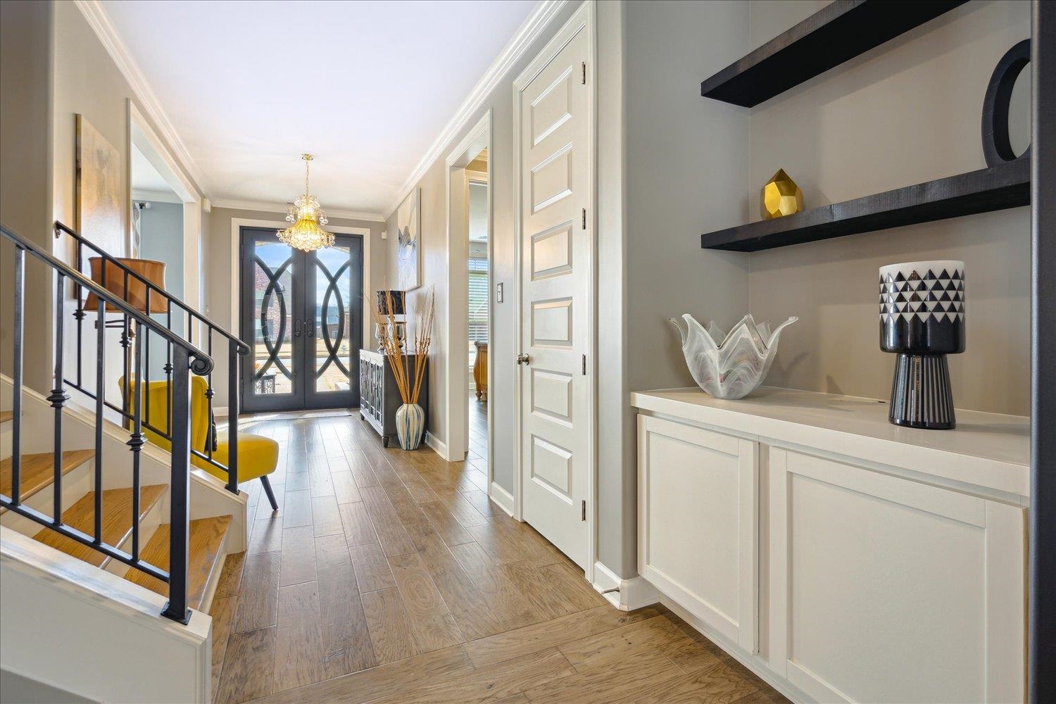 10460 Riley River Road Lakeland, TN 38002 - Photo 8 of 39 Entryway featuring french doors, crown molding, and light hardwood / wood-style flooring