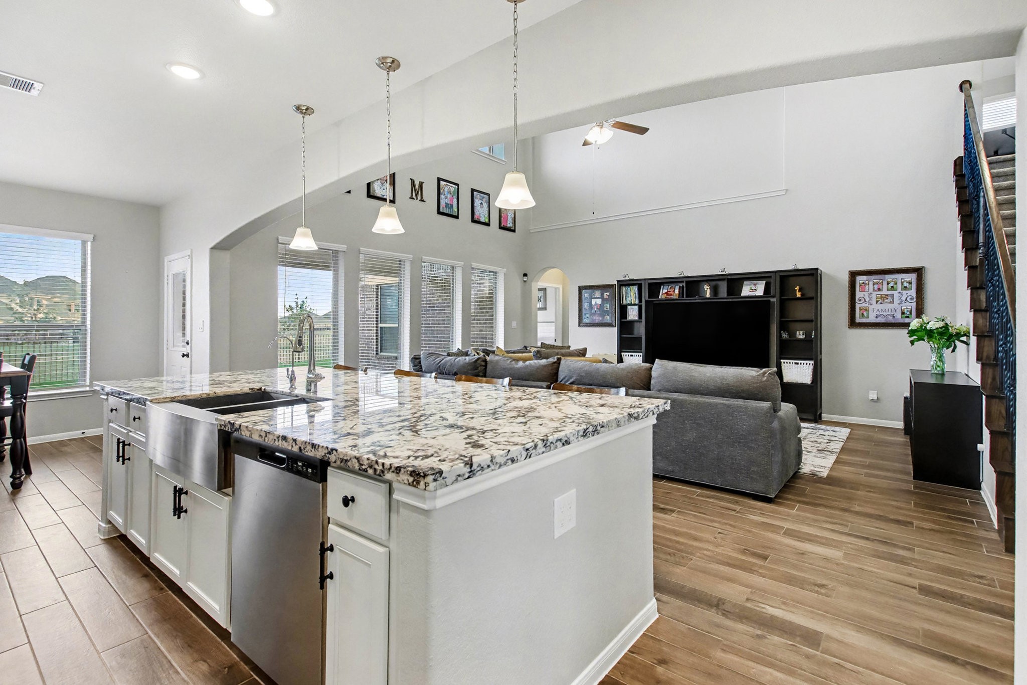 2510 Humble Way Rosenberg, TX 77471 - Photo 7 of 42 a kitchen with stainless steel appliances granite countertop a stove and a living room