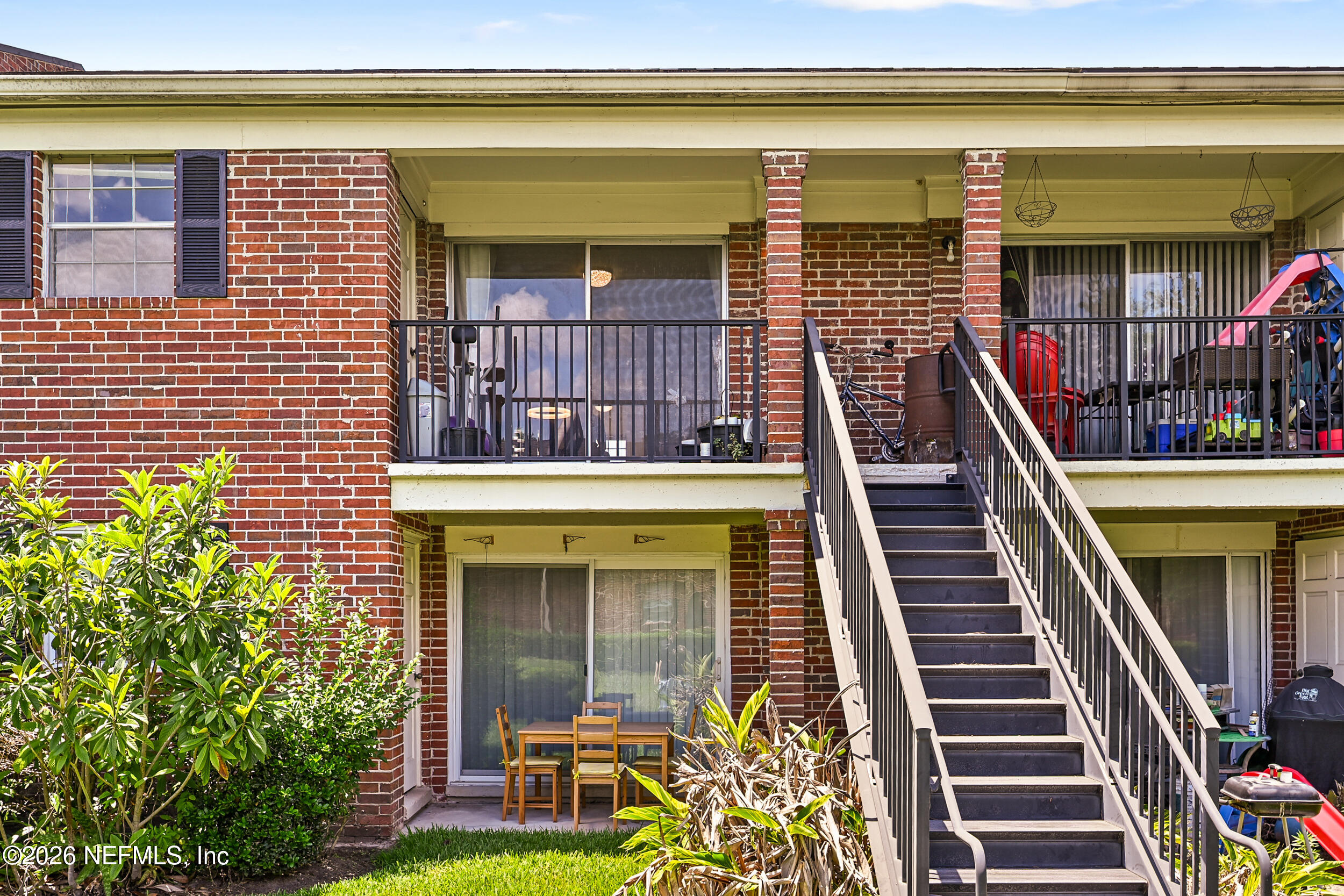 4915 Baymeadows Road, Unit 6G Jacksonville, FL 32217 - Photo 35 of 44 a front view of a house with a yard