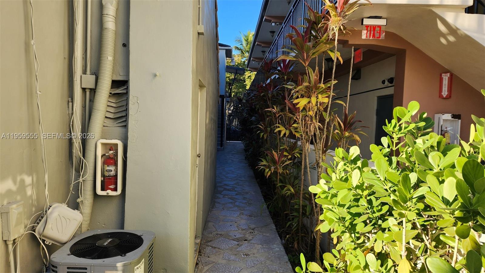 2272 Southwest 8th Street, Unit 5 Miami, FL 33135 - Photo 4 of 15 entry from Calle Ocho to the cottage