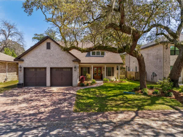 a view of a house with a yard and garage