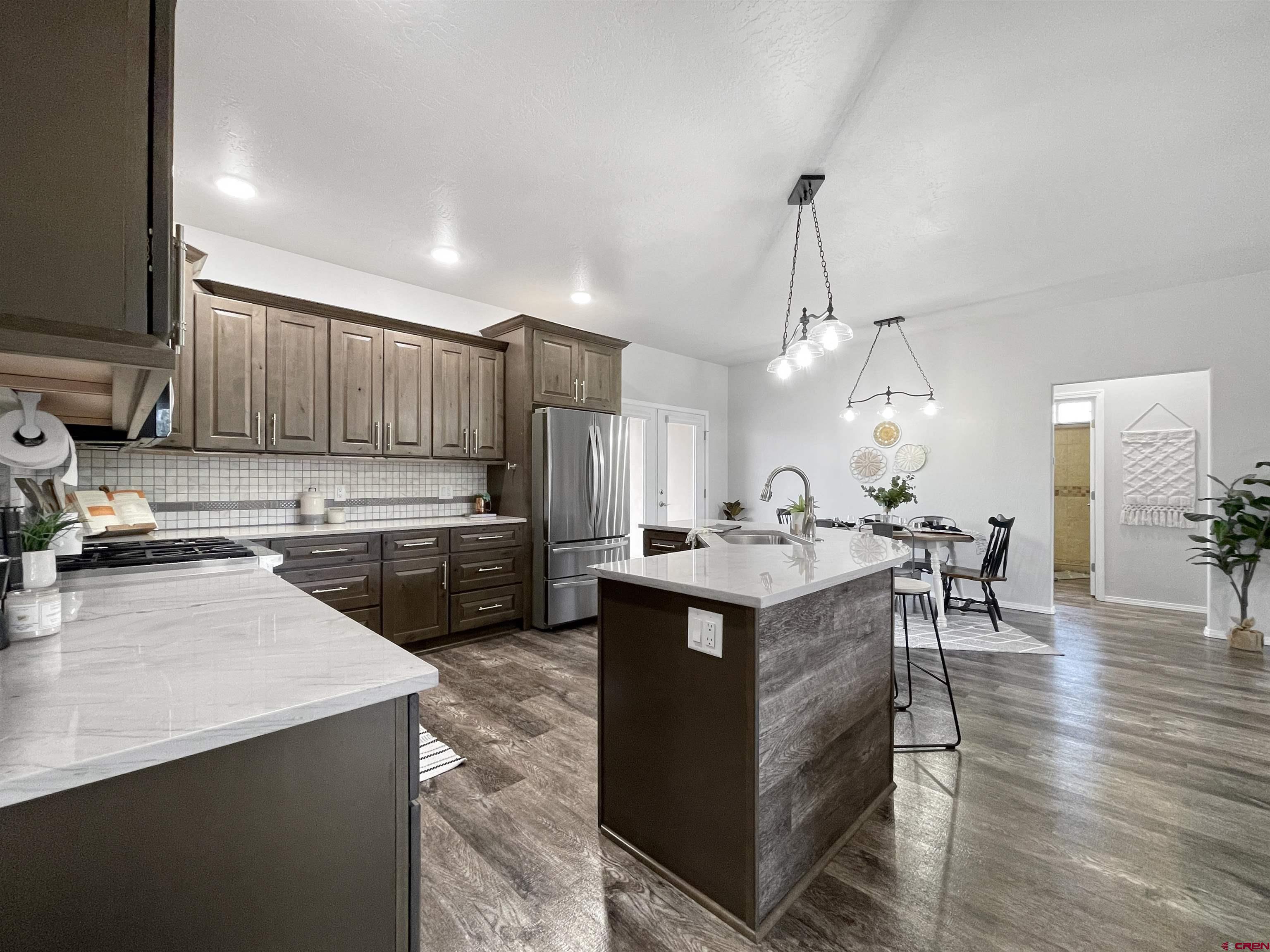 24026 Rd K.3 Cortez, CO 81321 - Photo 5 of 34 a kitchen with lots of counter top space and appliances