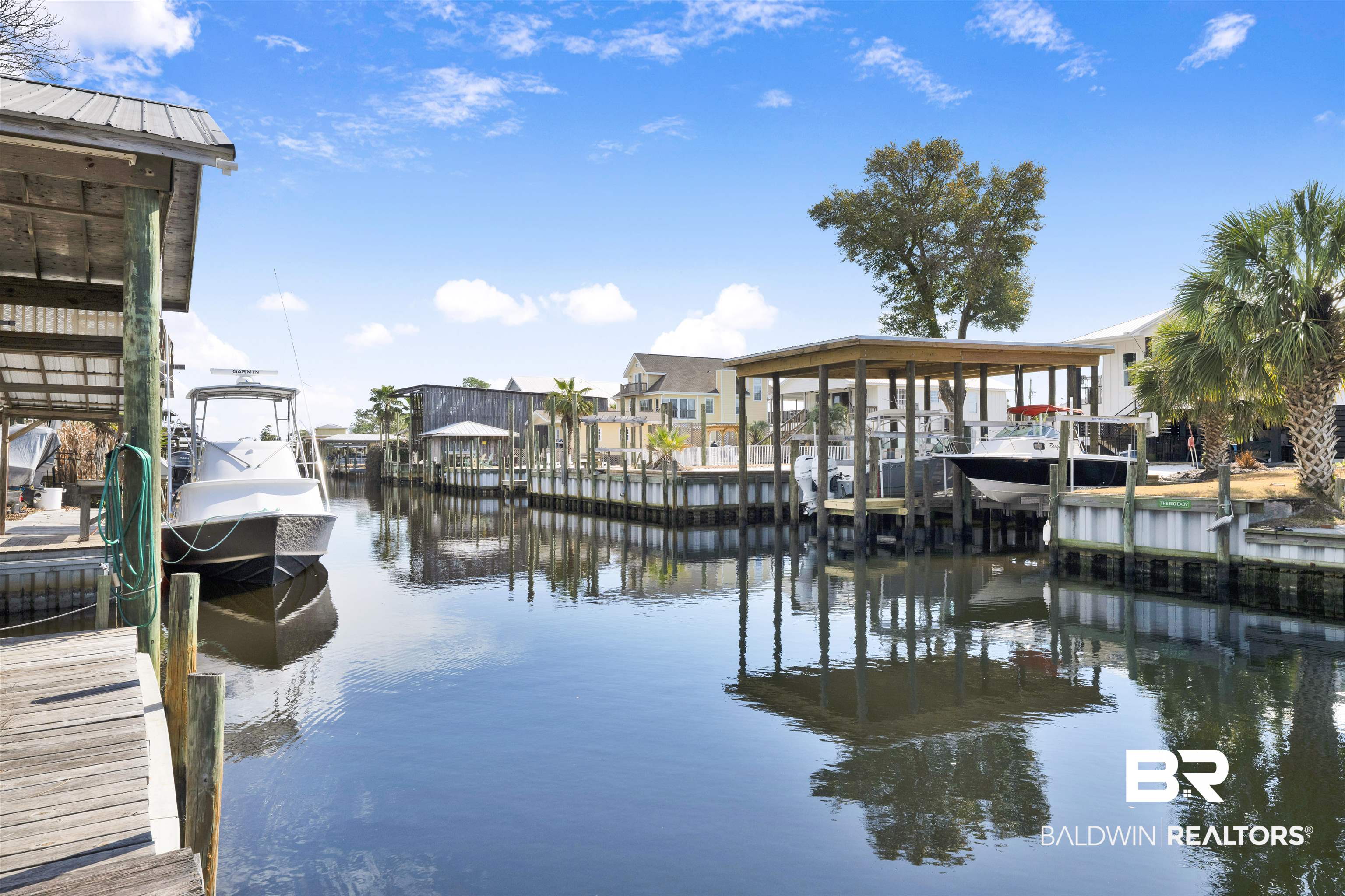 26222 Marina Road Orange Beach, AL 36561 - Photo 6 of 38 Dock with a water view and boat lift