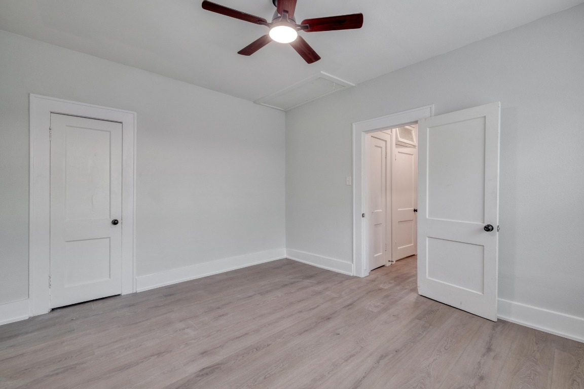 7406 Bethune Avenue Austin, TX 78752 - Photo 11 of 38 a view of empty room with wooden floor