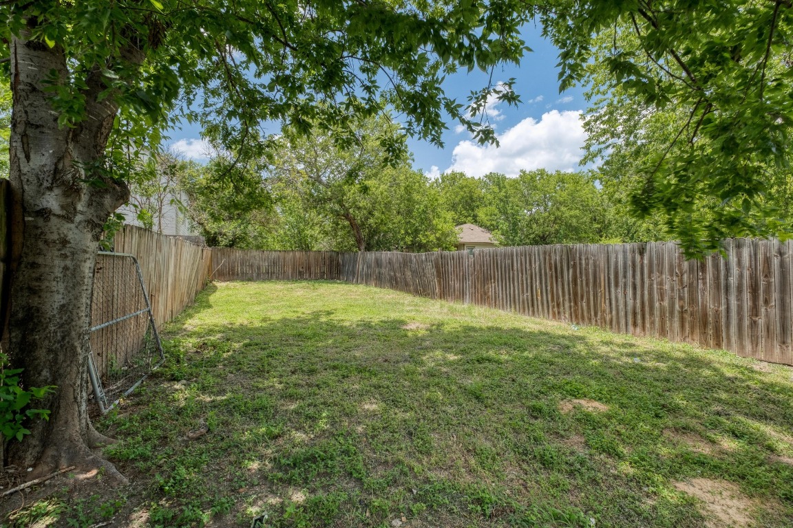 7406 Bethune Avenue Austin, TX 78752 - Photo 16 of 38 a view of garden with wooden fence