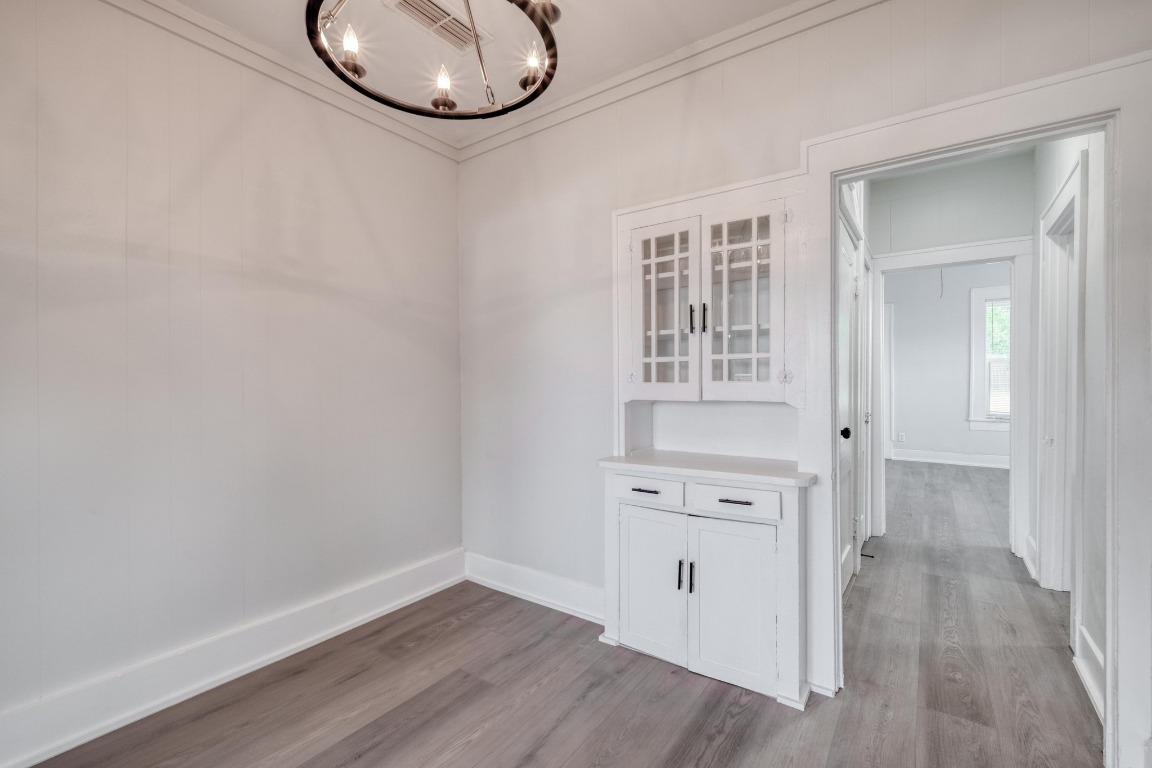 7406 Bethune Avenue Austin, TX 78752 - Photo 24 of 38 an empty room with wooden floor and windows