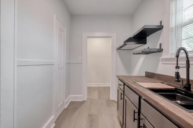 a kitchen with a sink and a refrigerator