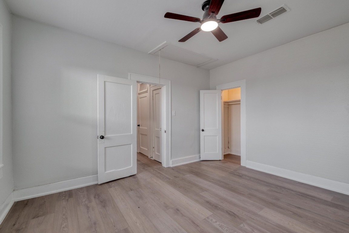 7406 Bethune Avenue Austin, TX 78752 - Photo 28 of 38 an empty room with wooden floor and windows