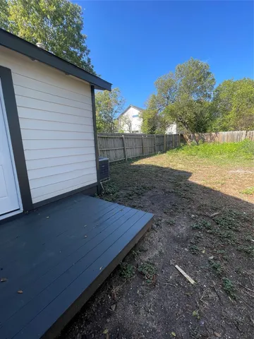 a view of a backyard of the house