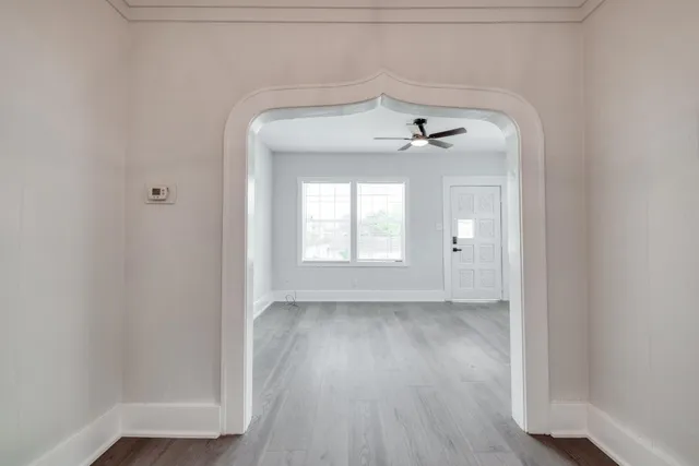 a view of a room with wooden floors and walls