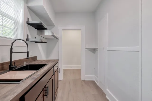 a kitchen with a sink and a stove