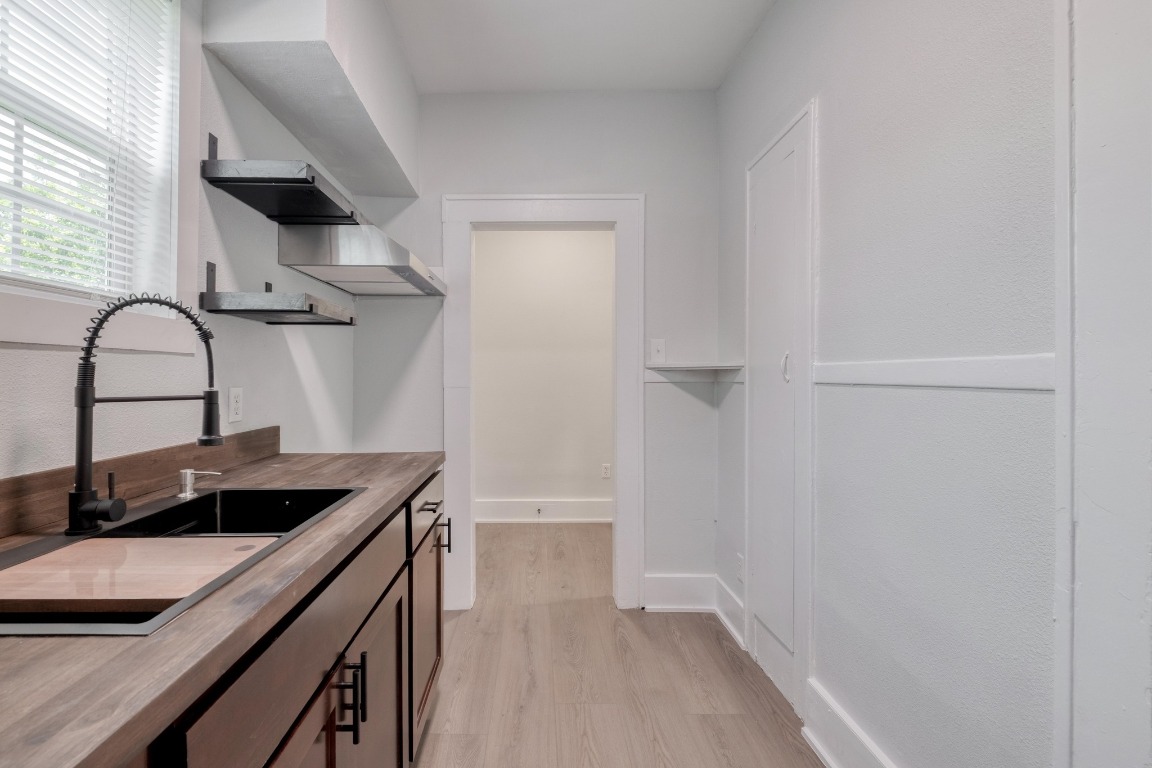 7406 Bethune Avenue Austin, TX 78752 - Photo 9 of 38 a kitchen with a sink and a stove
