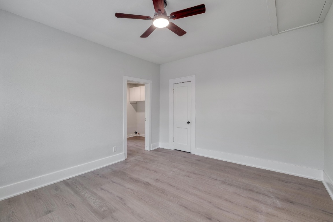 7406 Bethune Avenue Austin, TX 78752 - Photo 10 of 38 wooden floor in an empty room