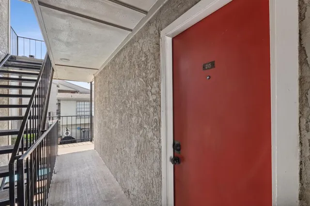 a view of a livingroom with an empty space and a fireplace
