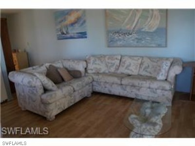 3241 Stringfellow Road St. James City, FL 33956 - Photo 3 of 7 a living room with furniture and a couch