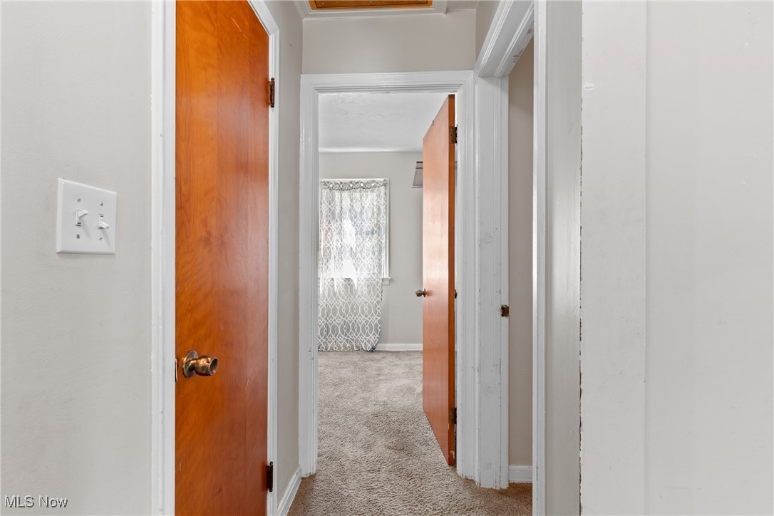 4503 Fulton Road Old Brooklyn, OH 44144 - Photo 9 of 24 Hall with carpet flooring and baseboards
