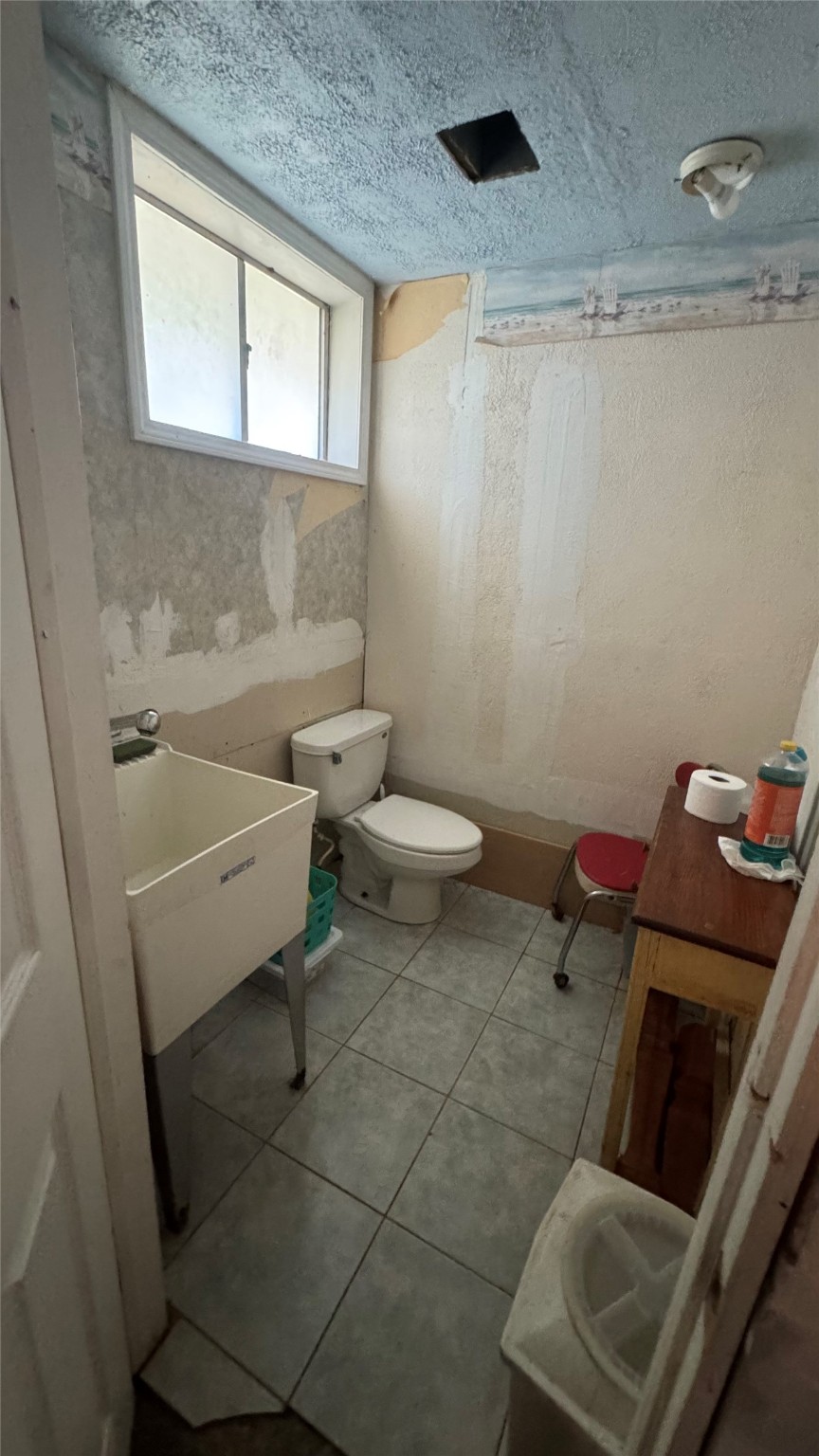 4717 17th Street Bacliff, TX 77518 - Photo 11 of 16 a bathroom with a toilet and a sink