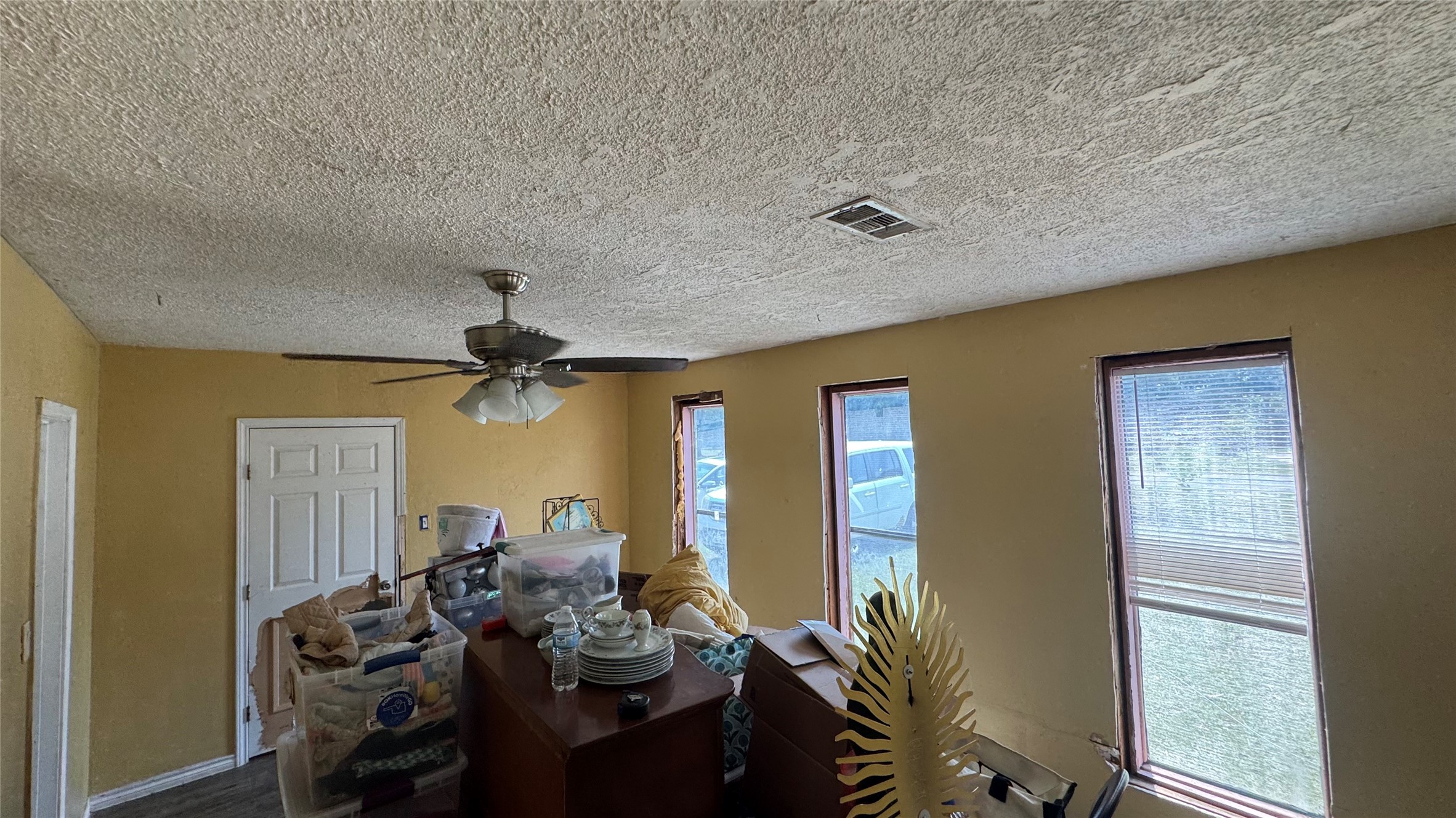 4717 17th Street Bacliff, TX 77518 - Photo 16 of 16 a living room with furniture and a chandelier