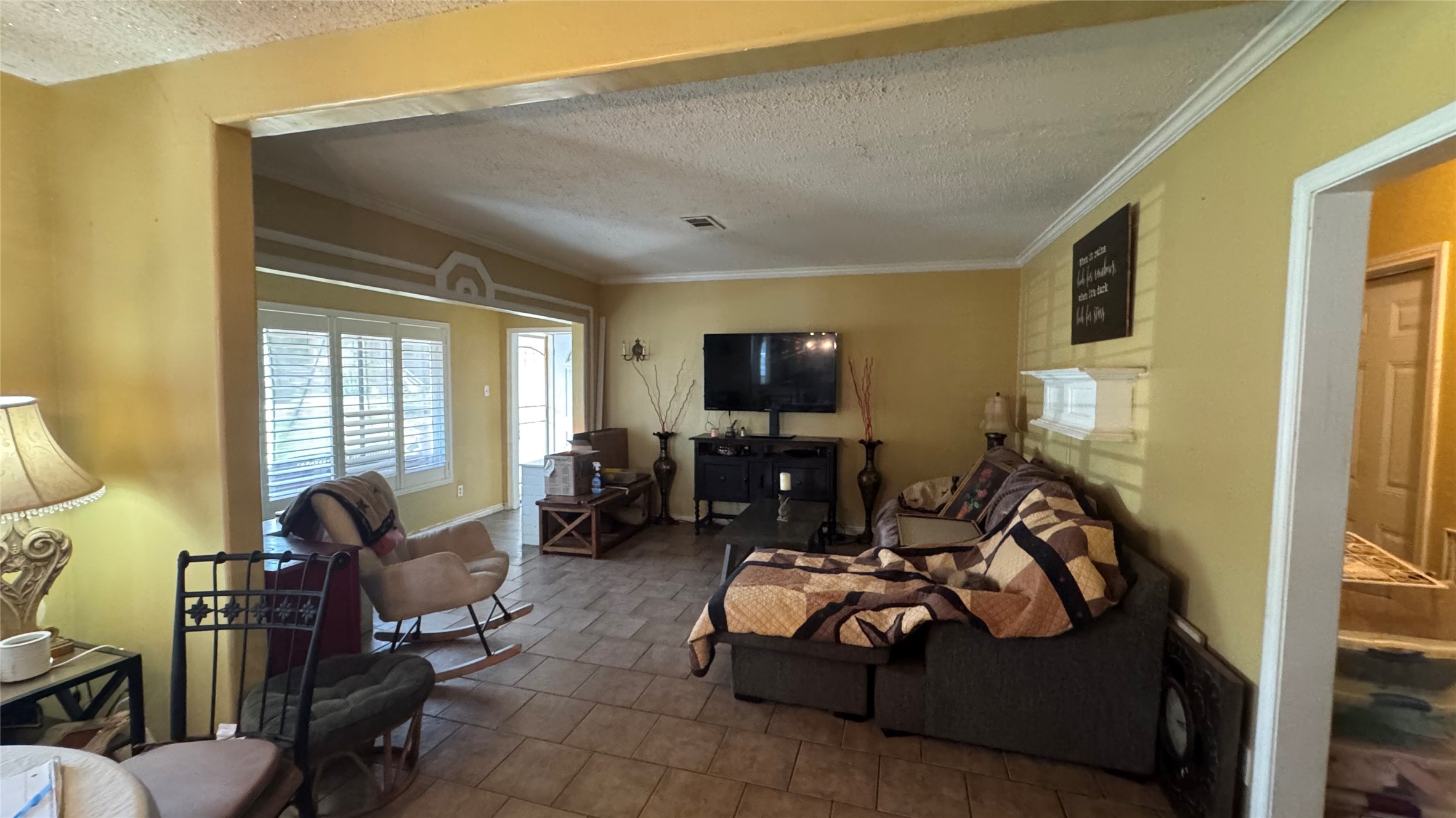 4717 17th Street Bacliff, TX 77518 - Photo 6 of 16 a living room with furniture and a flat screen tv