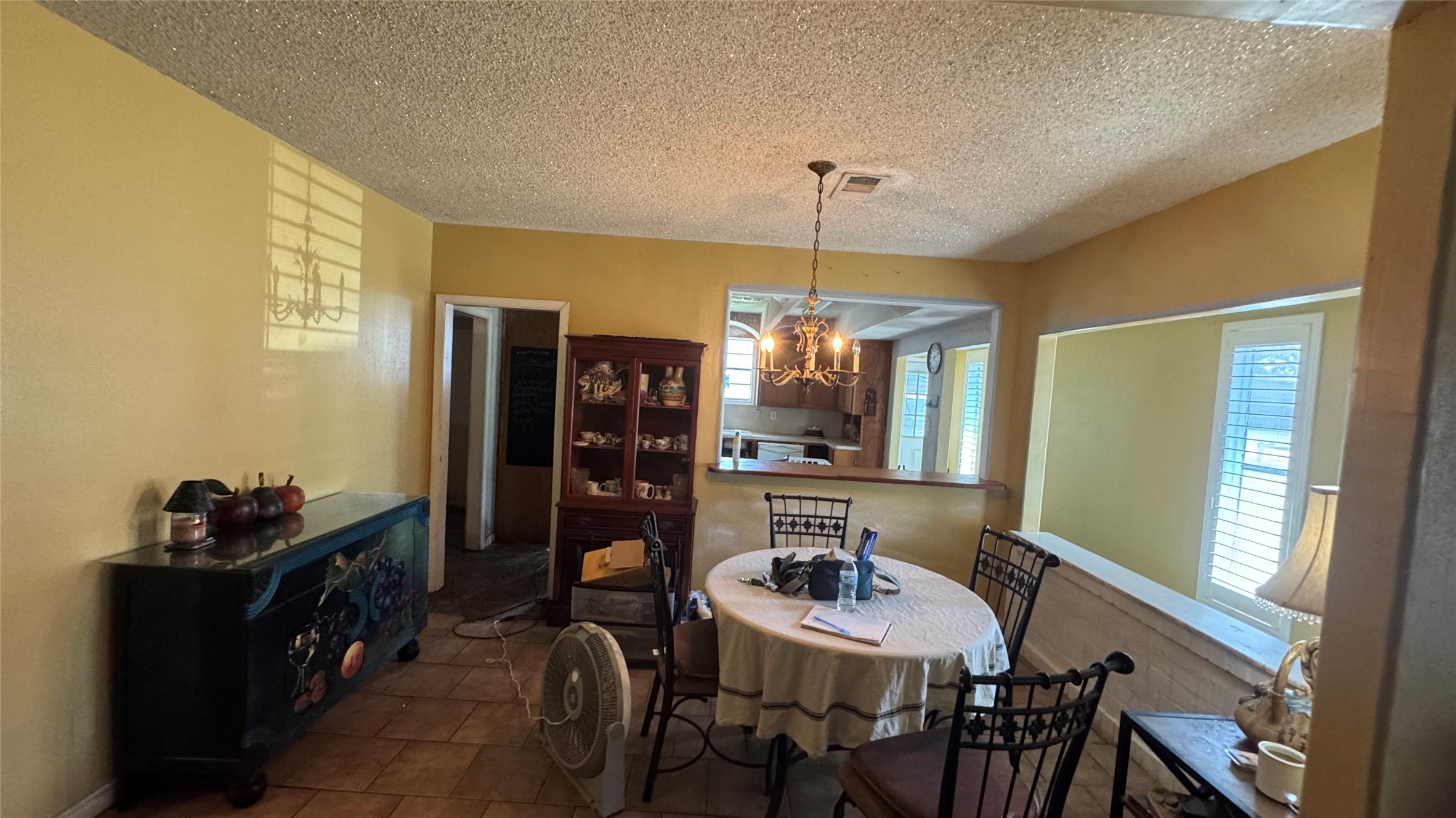 4717 17th Street Bacliff, TX 77518 - Photo 7 of 16 a view of a dining room with furniture and chandelier