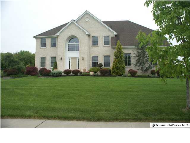 5 Cedar Knoll Road Jackson, NJ 08527 - Photo 1 of 3 a front view of a house with a garden