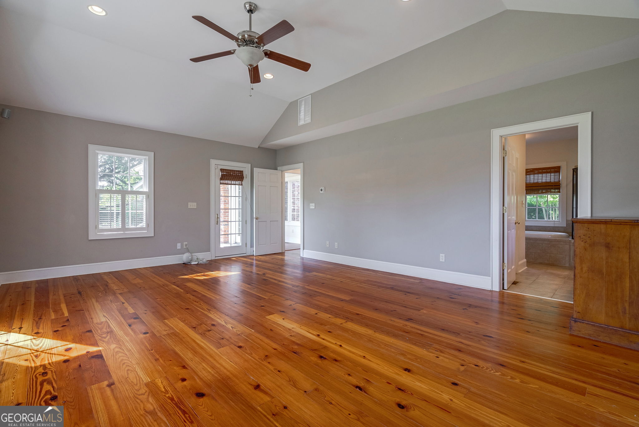 1761 Farmington Road Madison, GA 30650 - Photo 16 of 61 a view of an empty room with wooden floor and a window