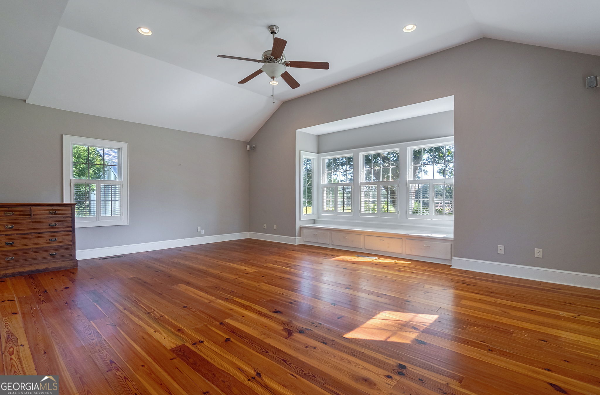 1761 Farmington Road Madison, GA 30650 - Photo 17 of 61 a view of empty room with wooden floor and fan