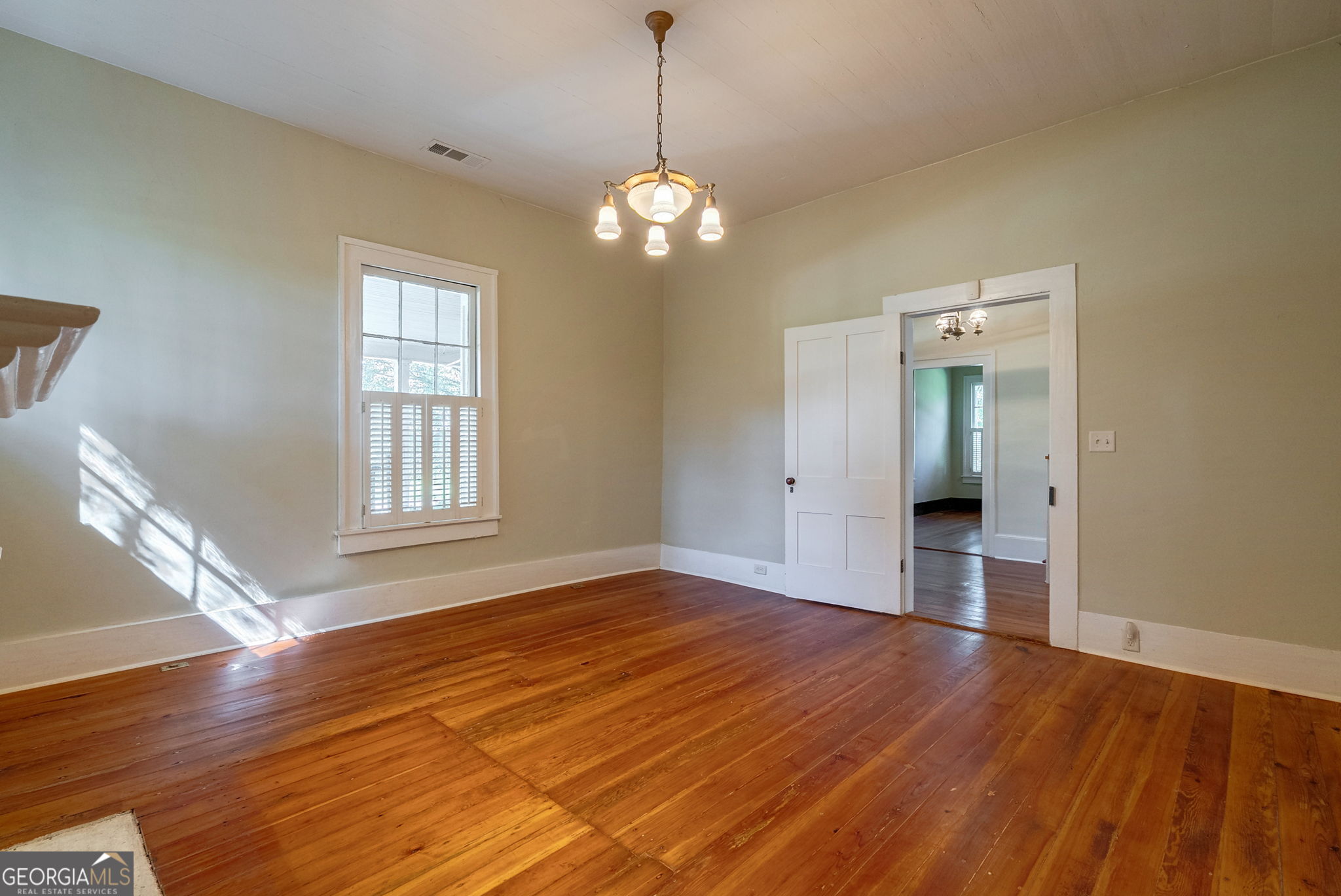 1761 Farmington Road Madison, GA 30650 - Photo 25 of 61 a view of empty room with wooden floor and fan