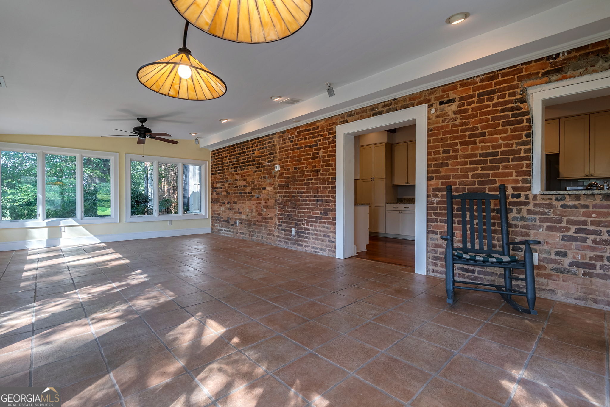 1761 Farmington Road Madison, GA 30650 - Photo 29 of 61 a view of an empty room with a fireplace and a window