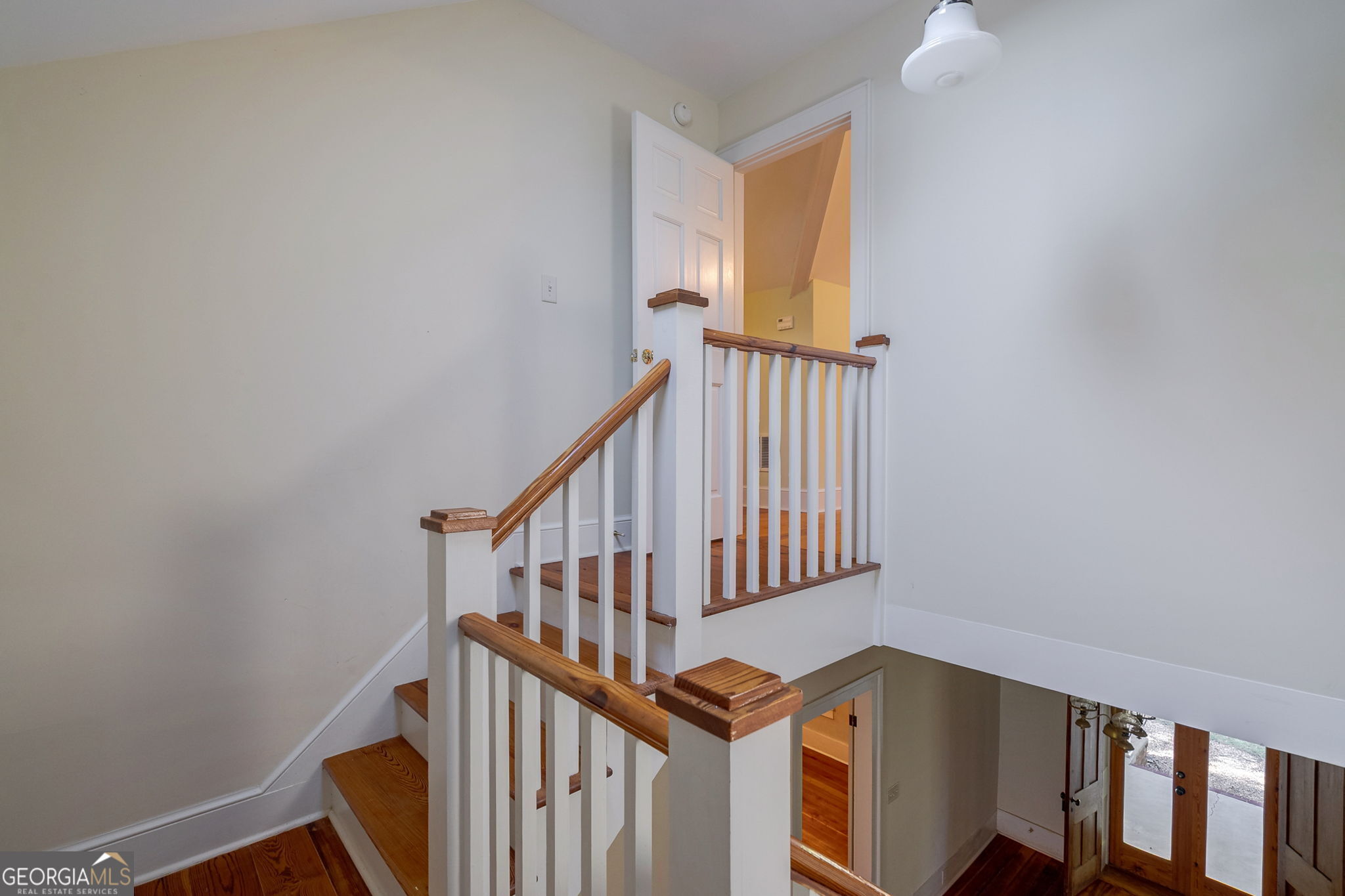 1761 Farmington Road Madison, GA 30650 - Photo 39 of 61 a view of staircase with railing and white walls