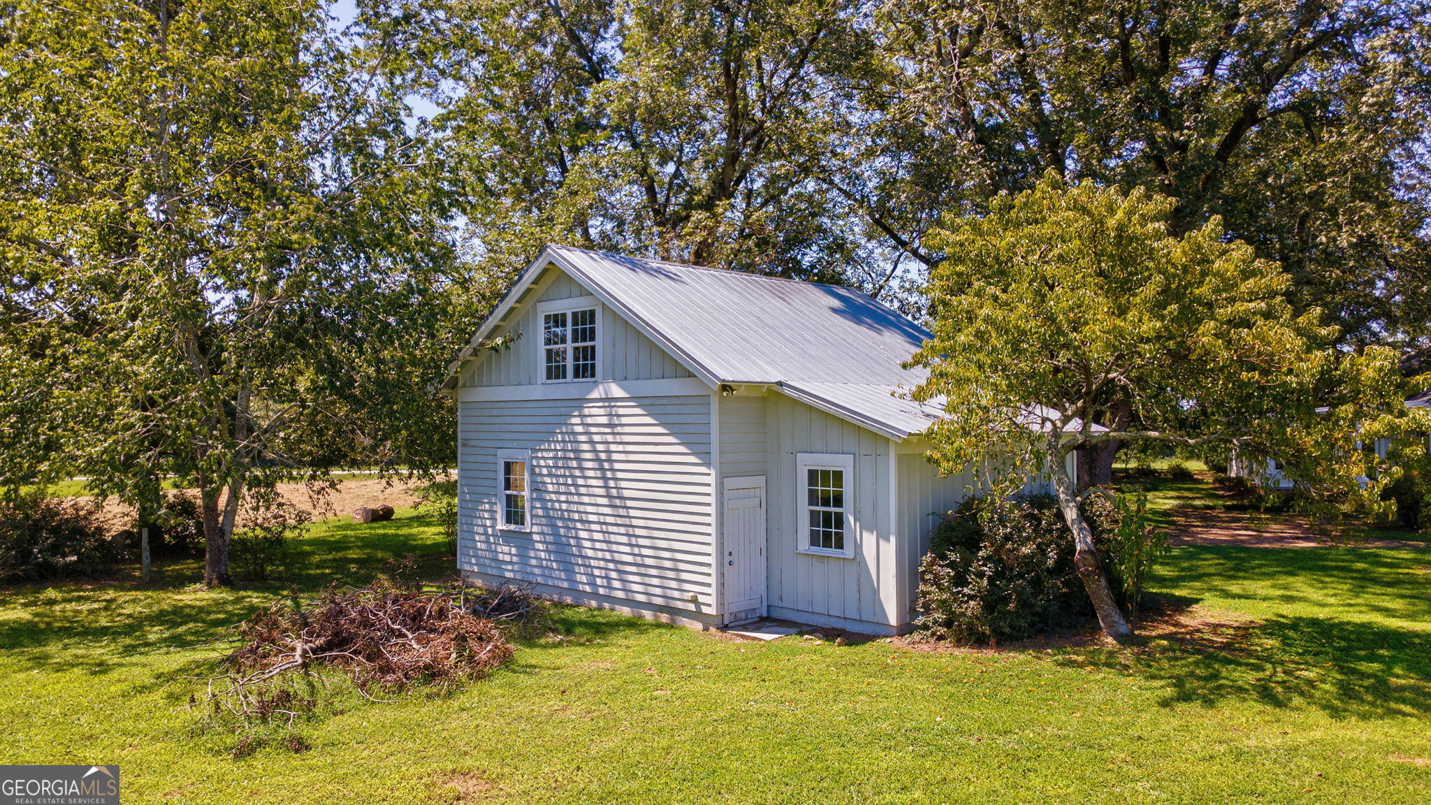 1761 Farmington Road Madison, GA 30650 - Photo 42 of 61 a view of a house with a yard