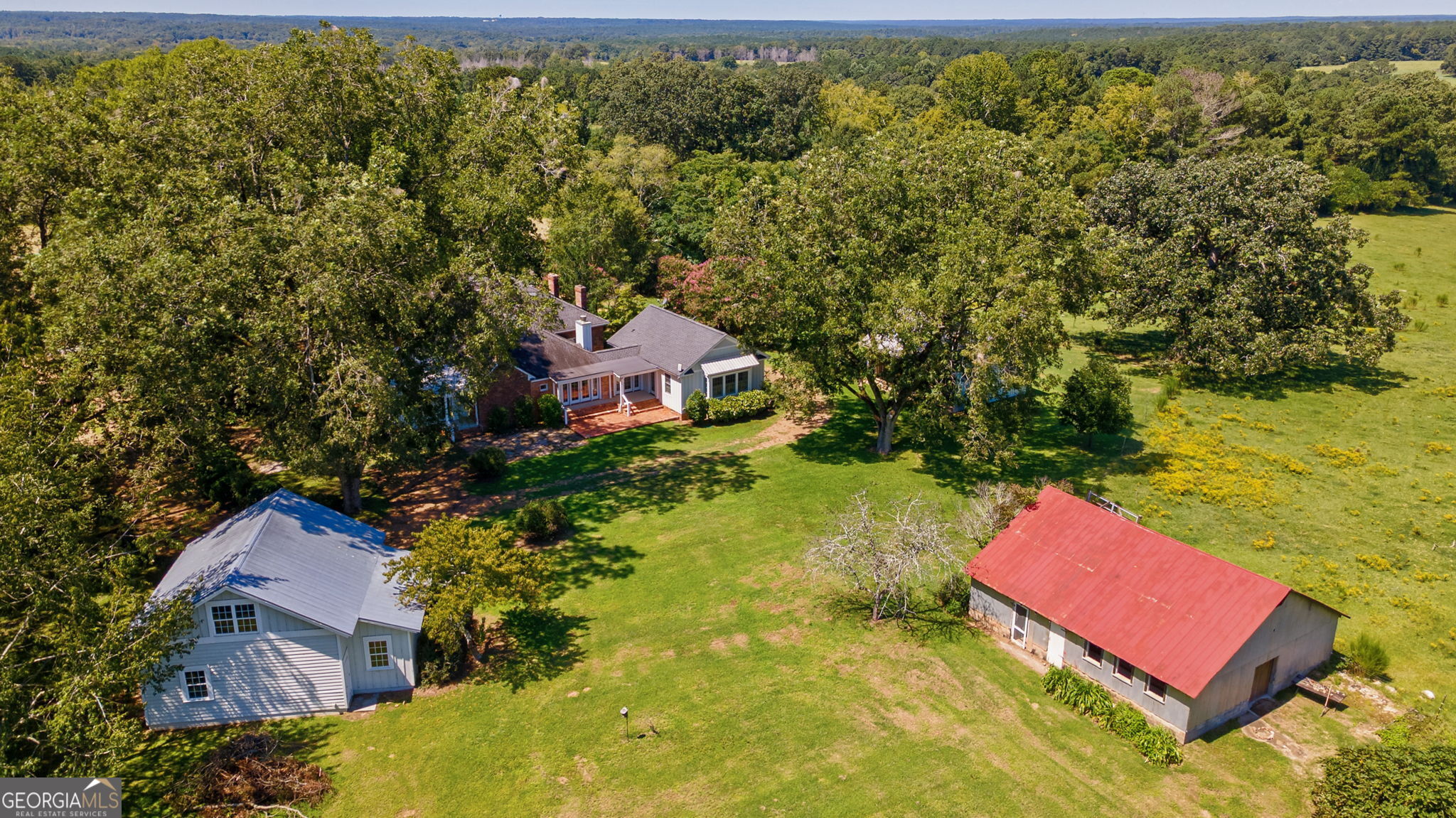 1761 Farmington Road Madison, GA 30650 - Photo 48 of 61 an aerial view of a house with a yard