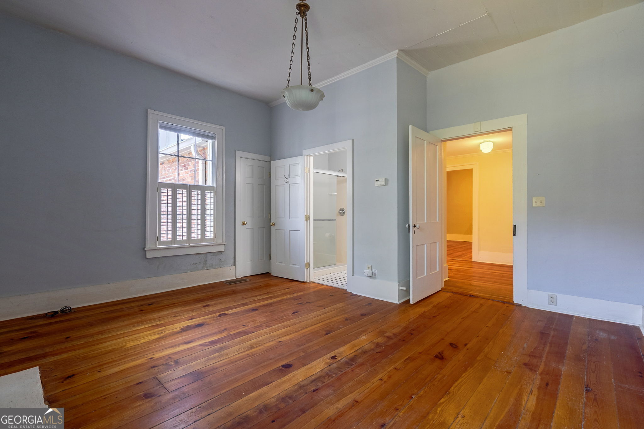1761 Farmington Road Madison, GA 30650 - Photo 7 of 61 a view of livingroom with hardwood floor and window