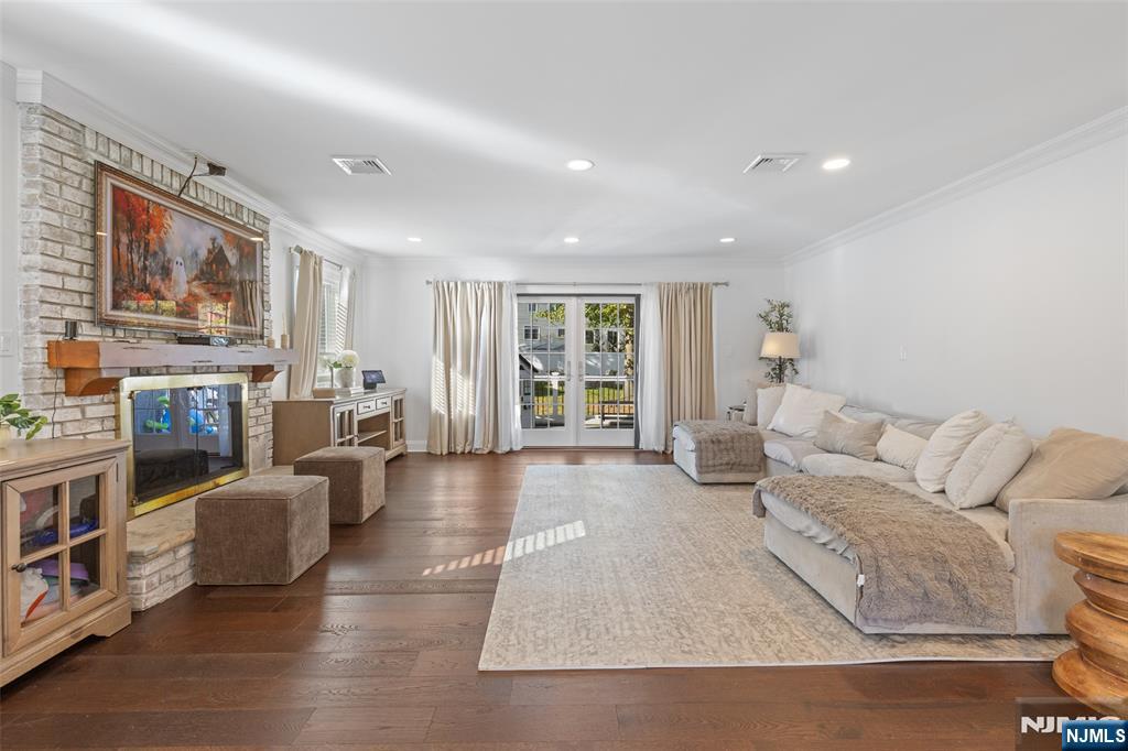 11 Robin Hood Way Wayne, NJ 07470 - Photo 11 of 36 a living room with fireplace furniture and a window