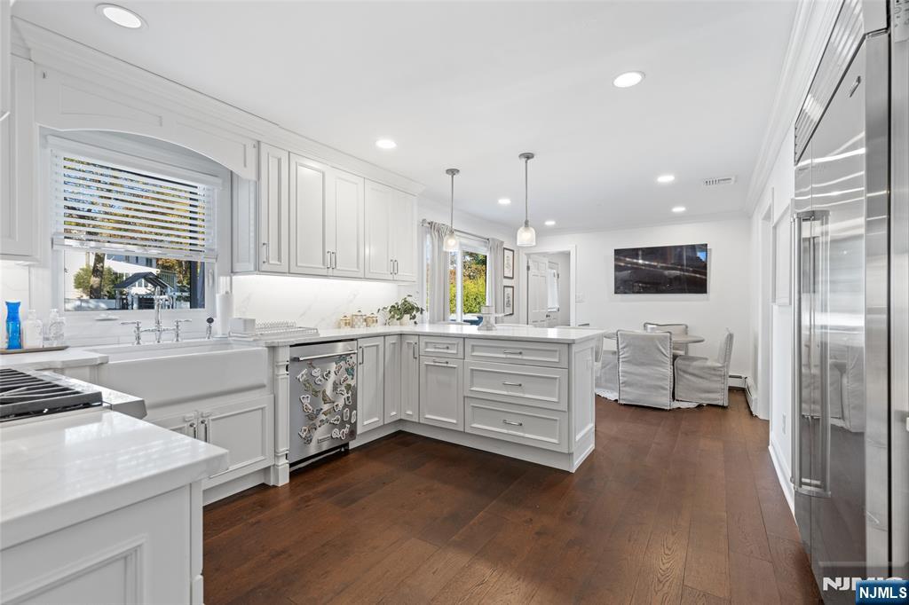 11 Robin Hood Way Wayne, NJ 07470 - Photo 12 of 36 a kitchen with counter top space and windows