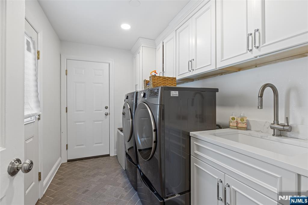 11 Robin Hood Way Wayne, NJ 07470 - Photo 16 of 36 a utility room with multiple dryer and washer