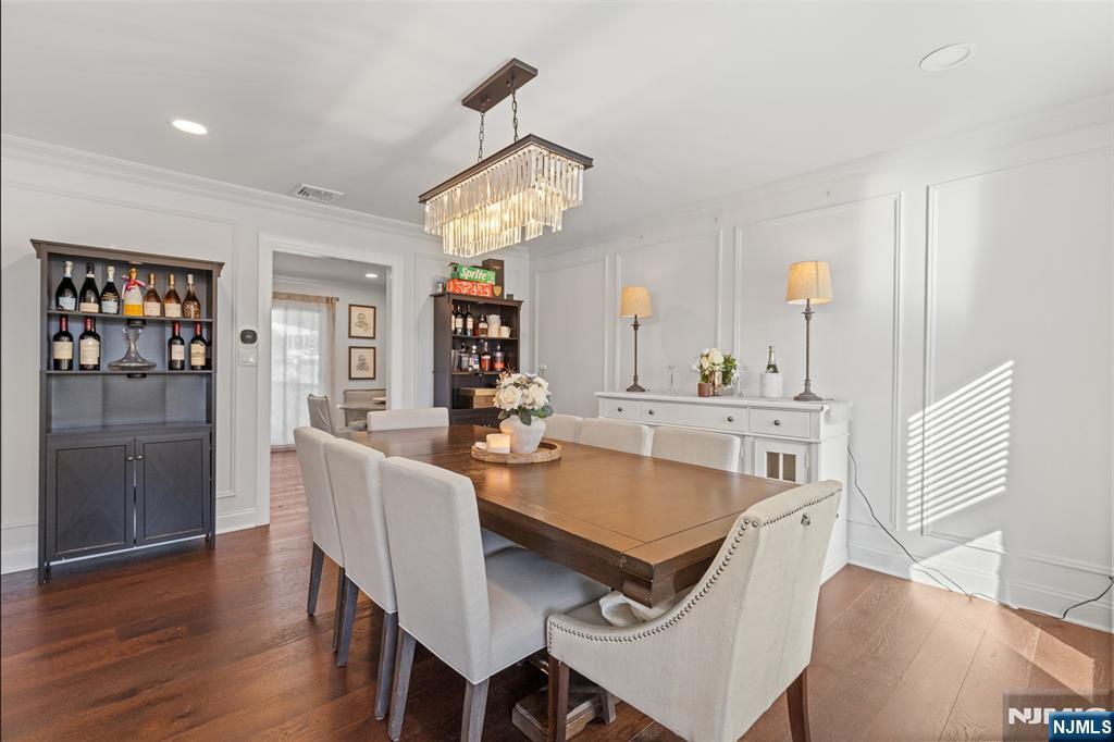 11 Robin Hood Way Wayne, NJ 07470 - Photo 17 of 36 a view of a dining room with furniture wooden floor and chandelier