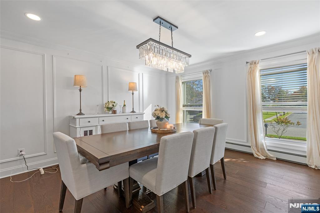 11 Robin Hood Way Wayne, NJ 07470 - Photo 18 of 36 a view of a dining room with furniture window and wooden floor