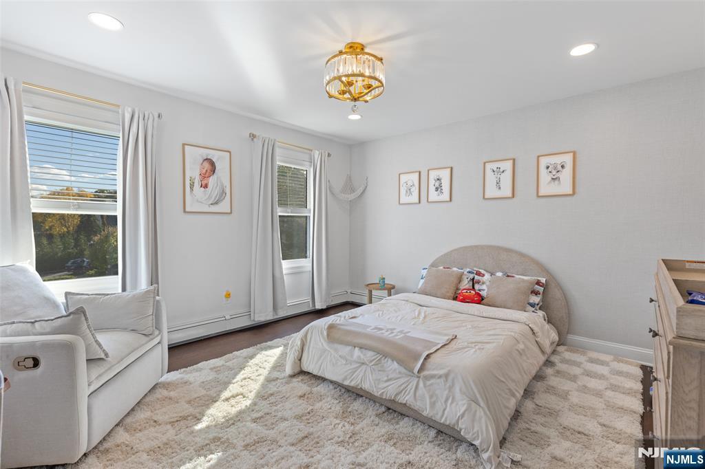 11 Robin Hood Way Wayne, NJ 07470 - Photo 24 of 36 a bedroom with a bed and a couch