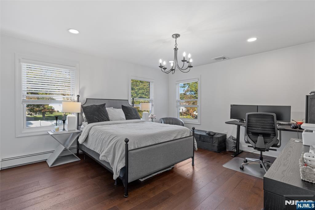 11 Robin Hood Way Wayne, NJ 07470 - Photo 26 of 36 a spacious bedroom with a bed and a desk