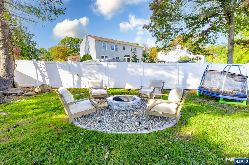 11 Robin Hood Way Wayne, NJ 07470 - Photo 31 of 36 a view of a chair and table in backyard of the house