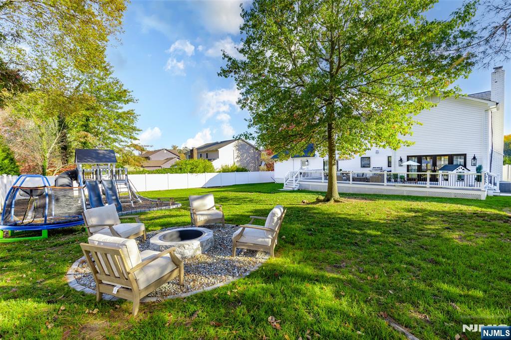 11 Robin Hood Way Wayne, NJ 07470 - Photo 32 of 36 a view of backyard with swimming pool and seating space