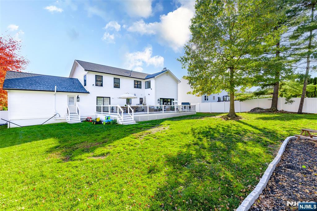 11 Robin Hood Way Wayne, NJ 07470 - Photo 6 of 36 a view of house with a big yard and large trees