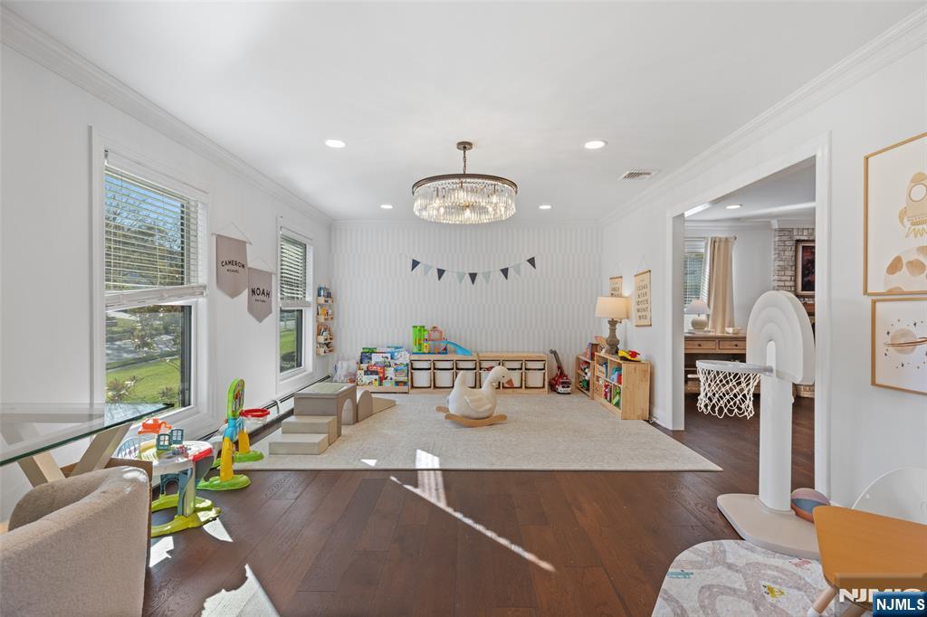 11 Robin Hood Way Wayne, NJ 07470 - Photo 7 of 36 a living room with furniture and a chandelier